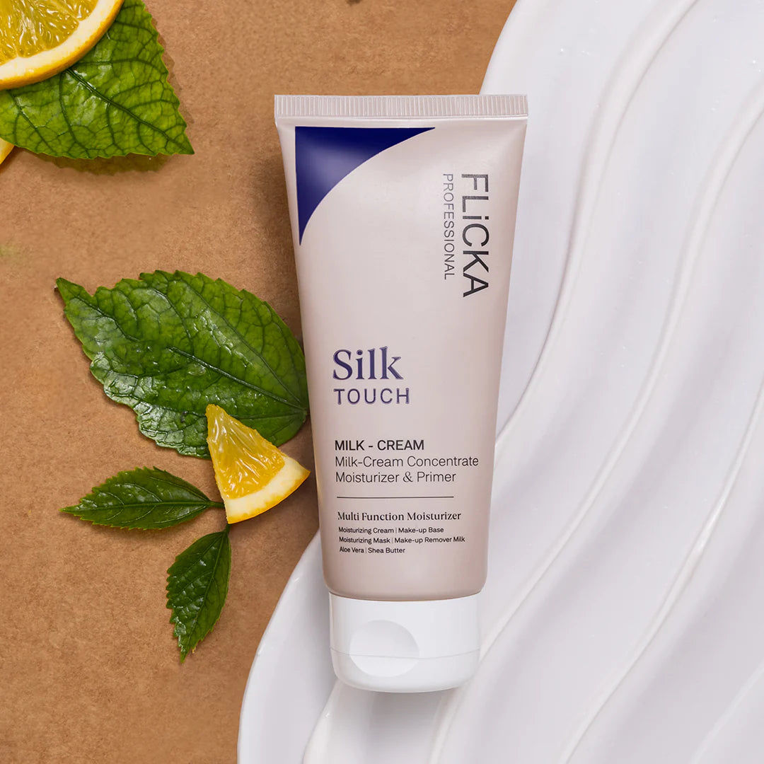 Flicka Silk Touch cream tube with lemon slices and leaves on a brown background